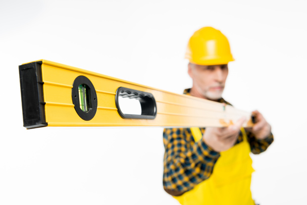 Workman with level tool - Photo, Image