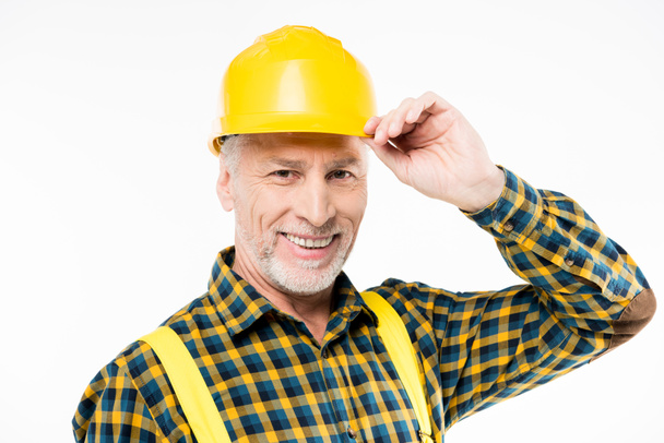 Trabajador maduro en sombrero duro
 - Foto, Imagen