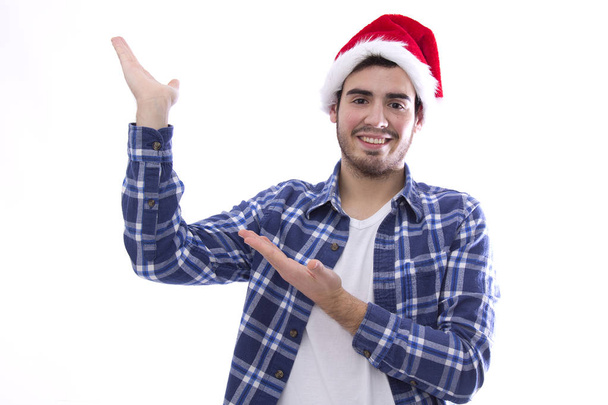 male young with hat of santa  - Φωτογραφία, εικόνα