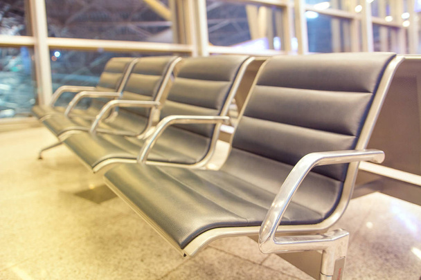 Rows of seats in airport lounge - 写真・画像