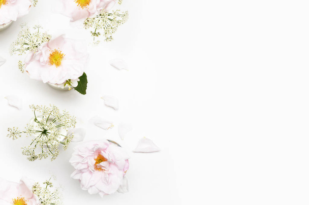 Flowers on white background. Flat lay. Mock-up desk. Beauty  - Foto, imagen