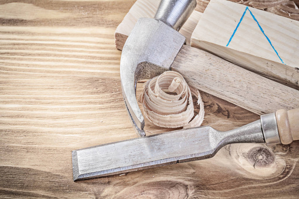 Claw hammer flat chisel wooden studs shavings on vintage wood bo - 写真・画像