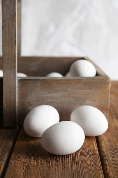 Raw eggs on table - Photo, image
