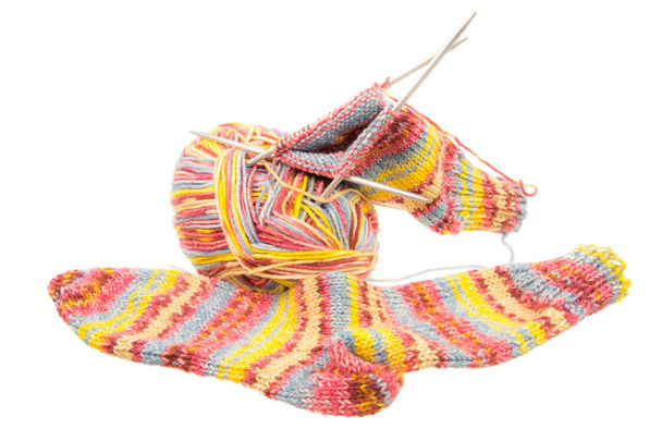 Isolated woolen socks with knitting equipment - Fotó, kép