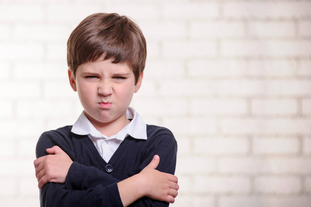 Portrait of primary angry school boy  - Photo, Image