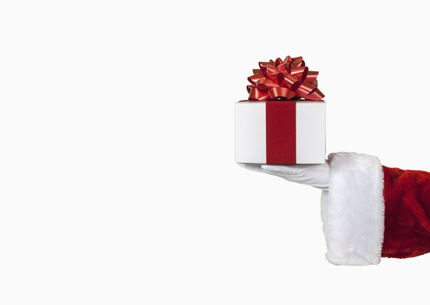 Santa Holding a Gift - Фото, изображение