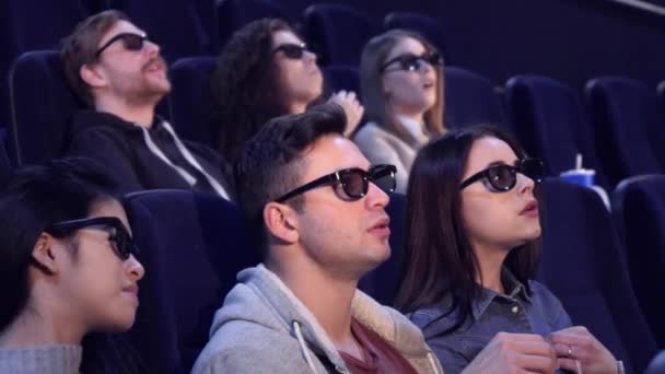People watch 3D film at the movie theater - Footage, Video