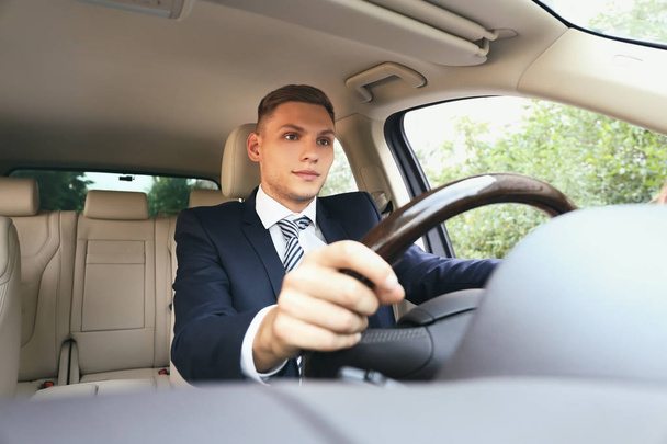 Young businessman driving car - Photo, Image