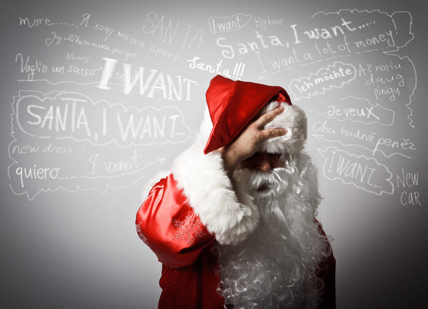 Frustrated Santa Claus and many wishes. - Photo, Image