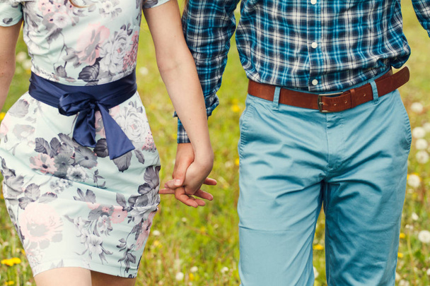 couple walking and holding hands - Foto, Imagem