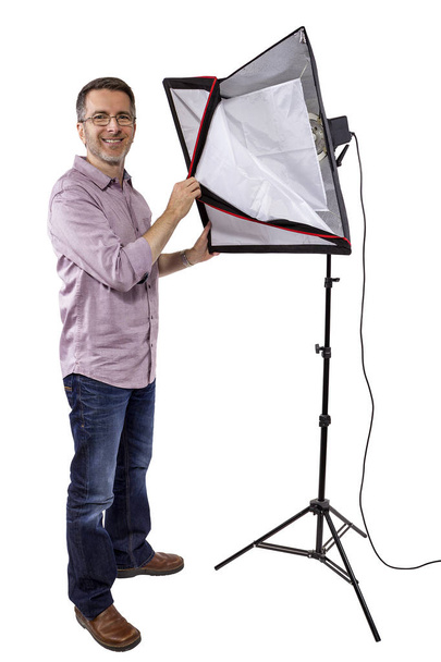 Photographe avec équipement d'éclairage studio
 - Photo, image
