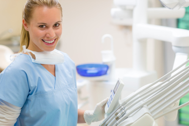 Female dentist with dental equipment at surgery - Foto, immagini