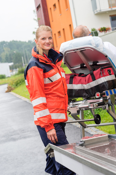 Patient on stretcher with paramedic emergency aid - Fotografie, Obrázek