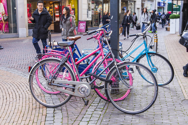 UTRECHT, NETHERLANDS, on March 30, 2016. Bicycles are parked on the city street - Foto, immagini