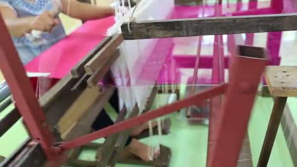 weaving brocade using a traditional loom machine with yarn - Footage, Video