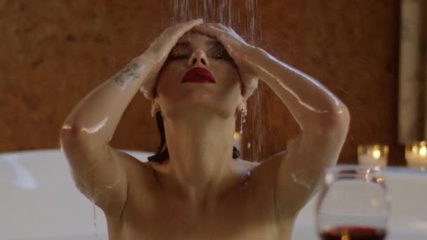 water flowing at beautiful woman with bright cosmetics - Materiał filmowy, wideo