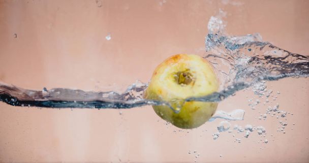 Apple dip in aquarium - Фото, изображение