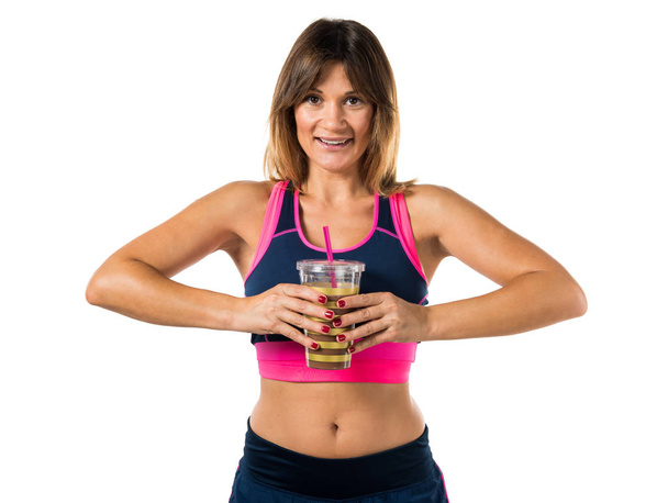 Athlete woman holding a sport drink - Фото, изображение