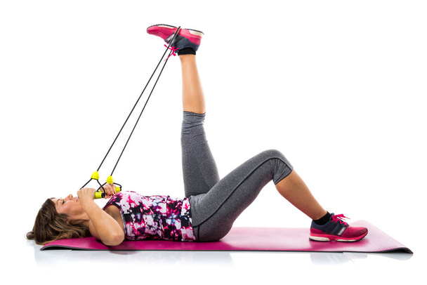 Sport woman stretching on mat - Фото, изображение