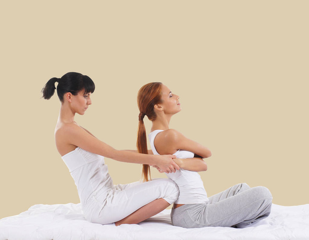 woman getting thai stretching massage  - Foto, afbeelding
