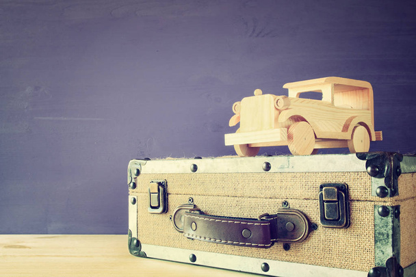 vintage toy car and old suitcase - 写真・画像