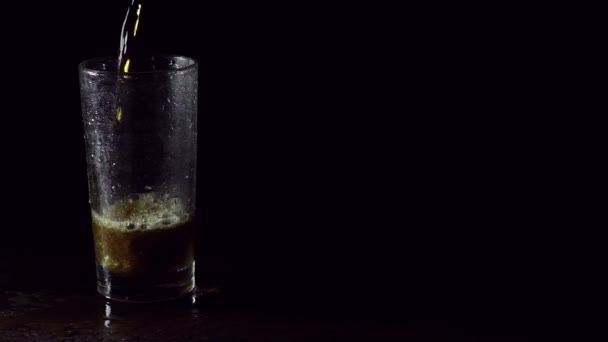Fresh soda in a glass on black background - Video