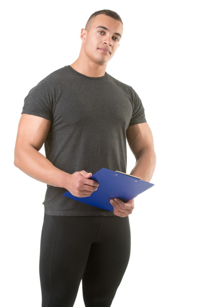 Personal Trainer Holding a Pad - Photo, Image