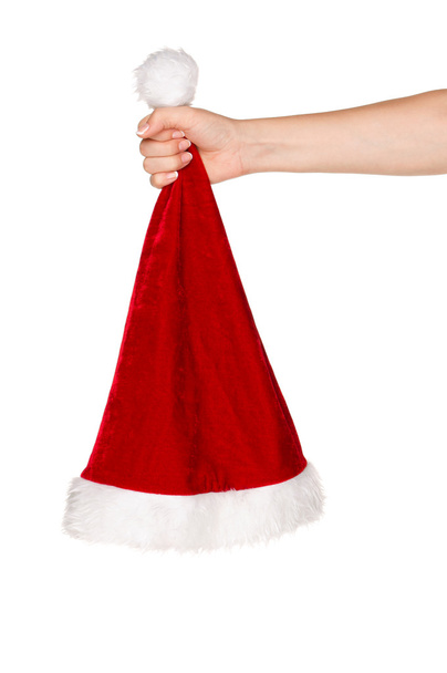 Mão com chapéu de Papai Noel
 - Foto, Imagem