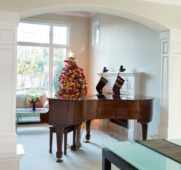 Living room with holiday decorations during bright daylight  - Photo, Image