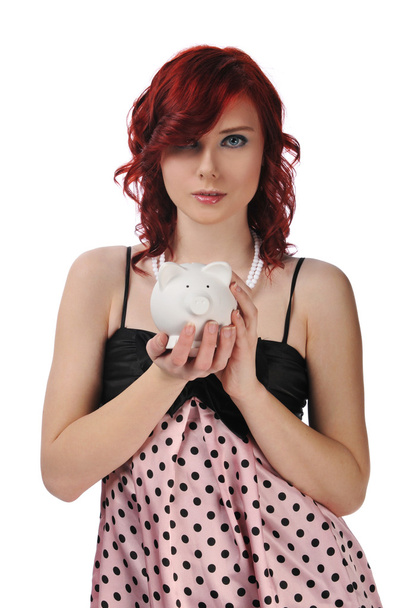 Woman holding a piggybank - Фото, изображение