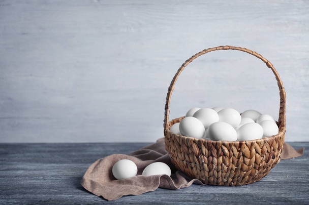 Raw eggs in basket - Photo, Image