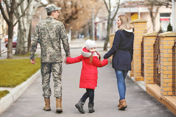 Happy soldier with family outdoors - Fotografie, Obrázek