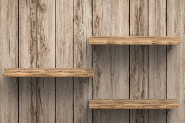 tres estantes de madera en la pared
 - Foto, Imagen