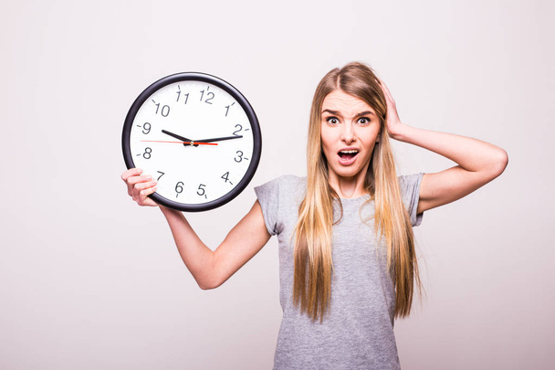 Shocked girl because be late at clock time - Фото, зображення