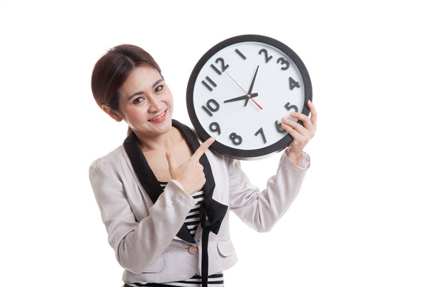 Young Asian business woman point to a clock. - Foto, immagini