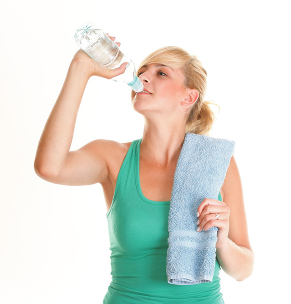 Beautiful girl drinking water blue bottle isolated - Fotó, kép