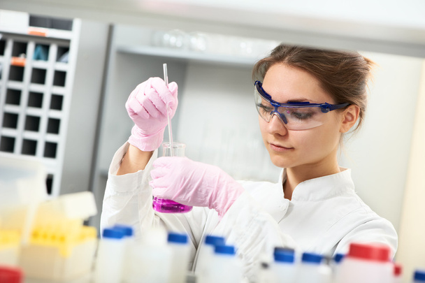 Woman chemist scientist researcher in laboratory - Фото, изображение
