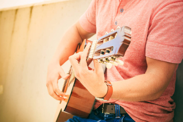 Trendy guy with guitar outdoor - Foto, immagini