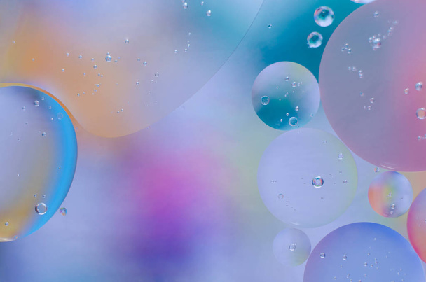 colored oil droplets on the water surface - Photo, image