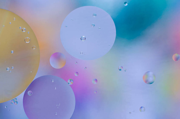 colored oil droplets on the water surface - Photo, Image