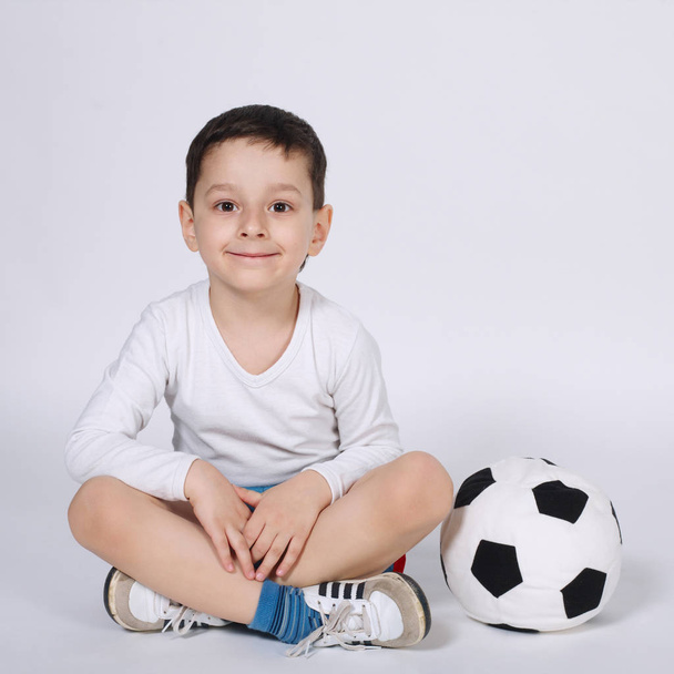little football player on white background - Φωτογραφία, εικόνα