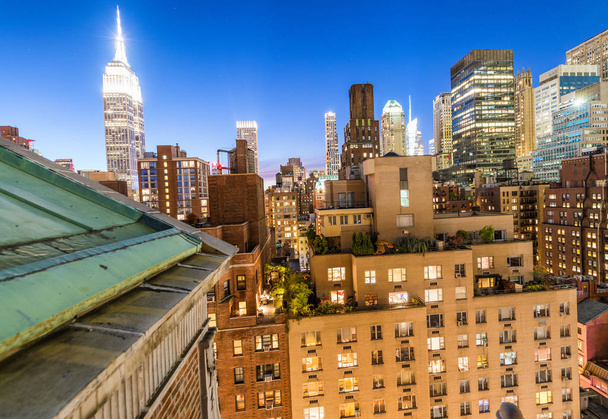 Ciudad de Nueva York. Edificios Midtown Manhattan al atardecer, aérea vi
 - Foto, Imagen