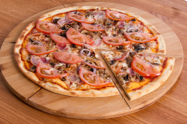 Pizzeria menu. Pizza on a wooden board - Foto, immagini