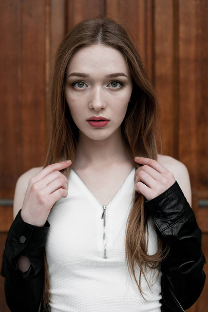 Young elegant trendy lady outdoors, wearing black and white clothing - Foto, Imagem