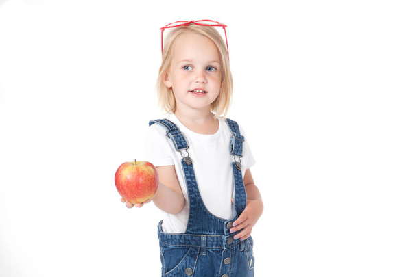  girl - a student holding an apple - Zdjęcie, obraz