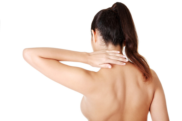 Young woman with pain in her back - Foto, Imagen