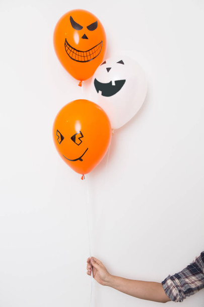 Halloween decoration of colored balloons with grins - Photo, Image