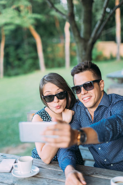 Young couple taking selfie - Фото, изображение