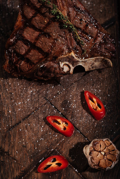 Top view of steak and vegetables lying on a table - Foto, Imagem