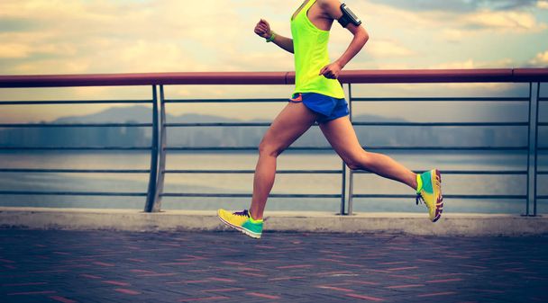 young fitness woman running seaside - Fotografie, Obrázek